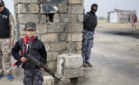 MOSUL, IRAK- MARCH, 2017: A littel girl is working at Mosul East checkpoint. (Picture by Veronique de Viguerie/ Reportage by Getty Images)